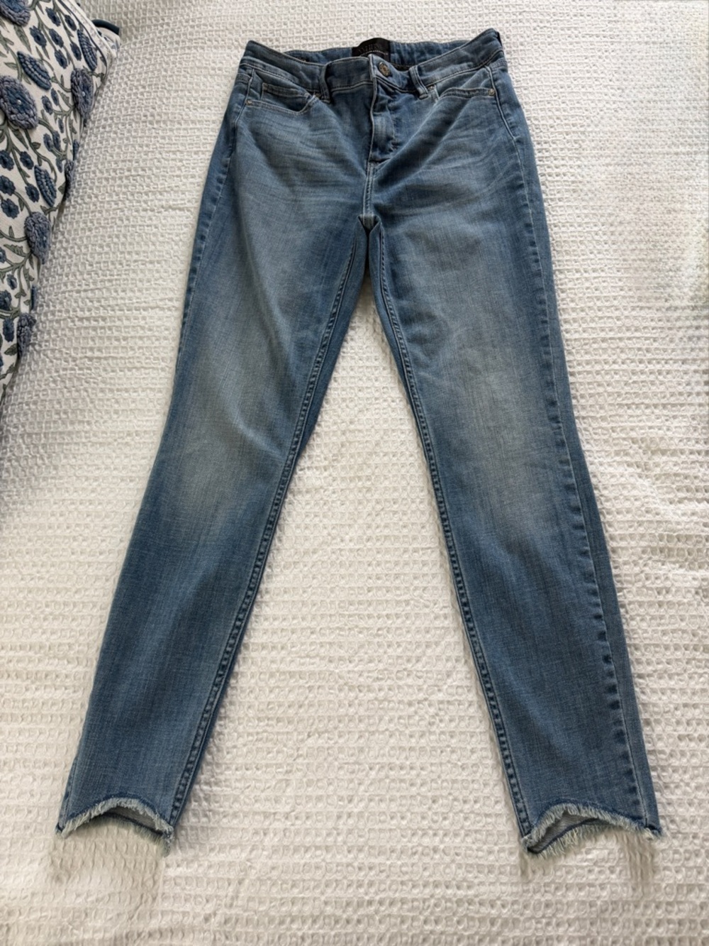 White House Black Market Extra High Rise  Skinny Jeans with frayed hem.